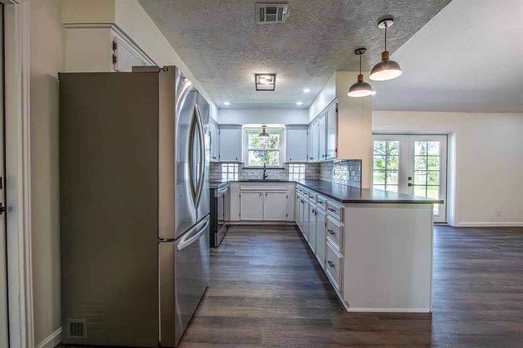 Kitchen Open to Living and View of Lake