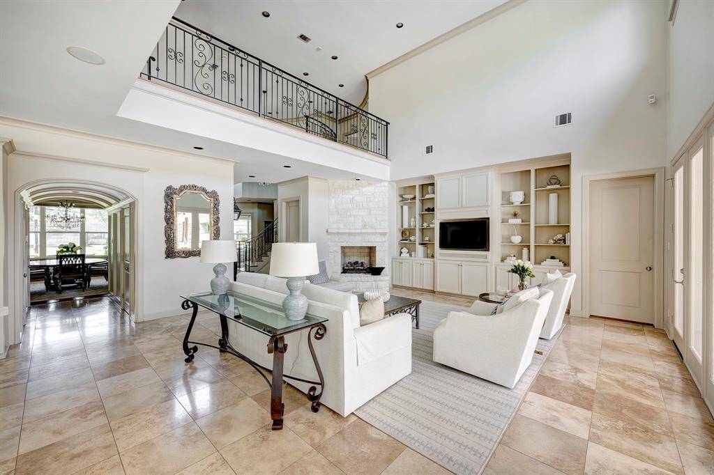 See the dining room through the archway and all of the beautiful natural light