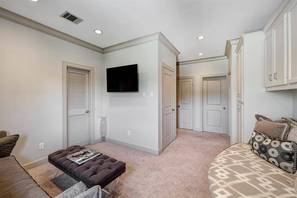 First-floor primary bedroom flows beautifully outside to the pool area