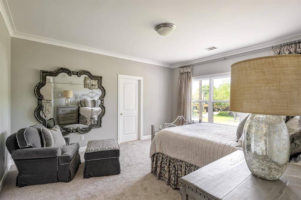 A true home theater with recliners, automatic shades and a wet bar