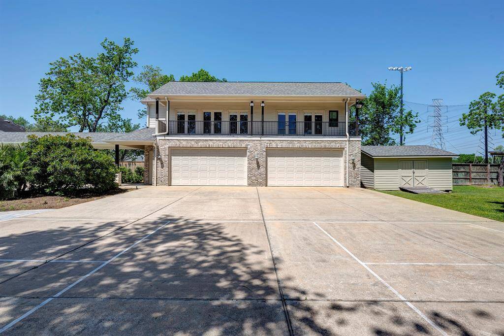 Four car garage and 1014 sf guest quarters