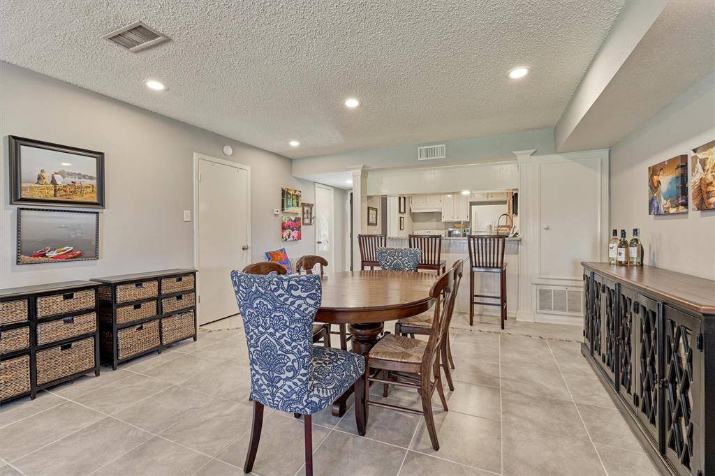 Ample room for formal or casual dining furnishings! The door to the left leads to the laundry closet under the stairs.