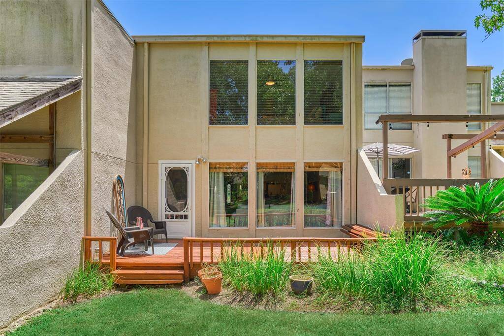 Full view of the back of the home. Bring your outdoor patio furniture to enjoy the serenity of the surrounding nature!