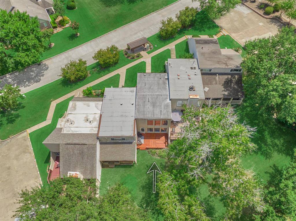 Aerial image of the home, rear deck and common area. Each property has its own unique style!