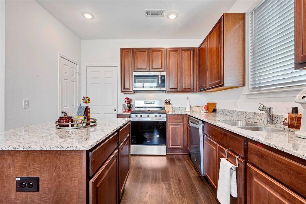 Complete with stainless steel appliances and granite countertops.