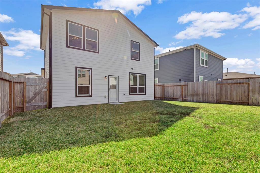 The backyard is ideal for pets to run around or a barbecue.