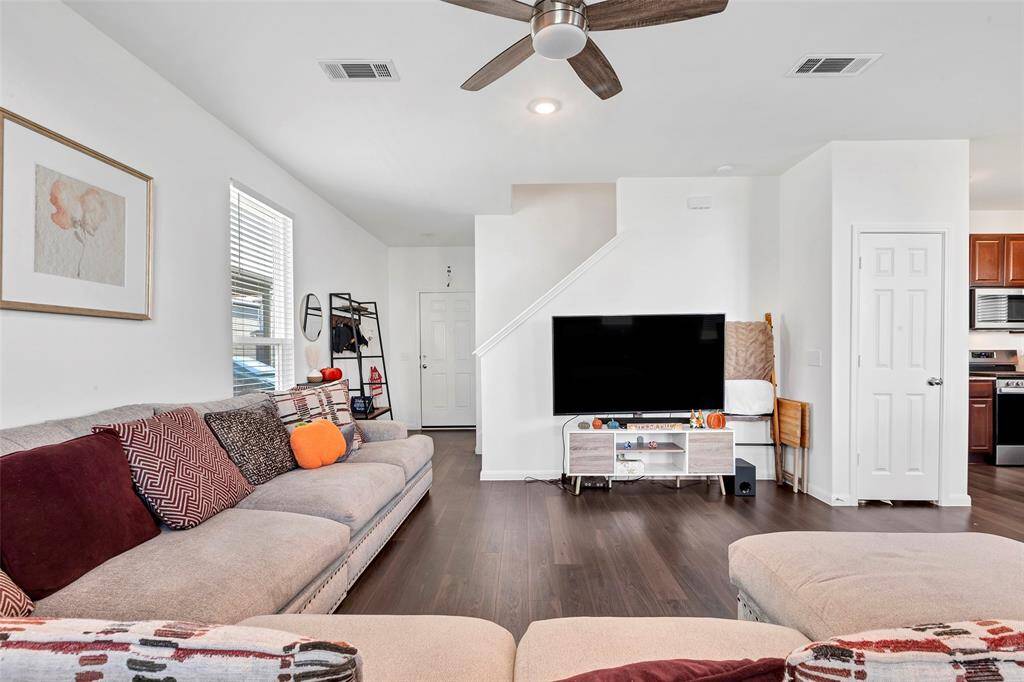 Another angle of the living room that shows your entry which has a half bath as well.