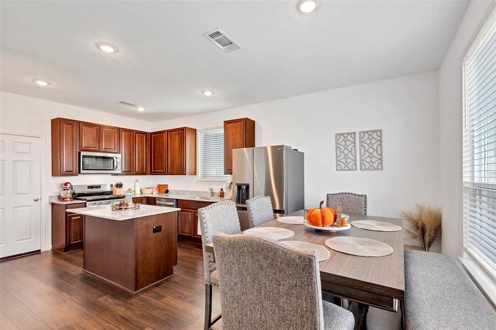 This home has an open concept layout that allows you to cook while chatting with your guests.