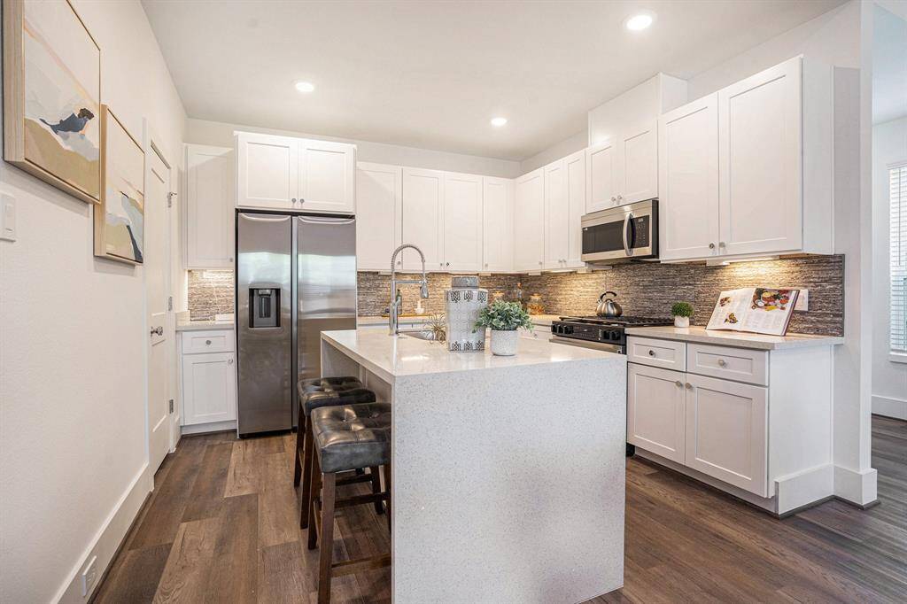 Quartz Countertops. Stainless Steel appliances. Model Home. Same floor plan. Finishes of home may vary.