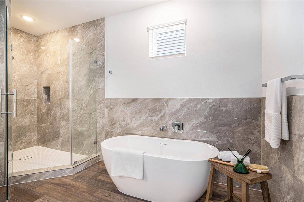 Primary Bath Soaking tub and separate shower. Model Home Finishes may vary.
