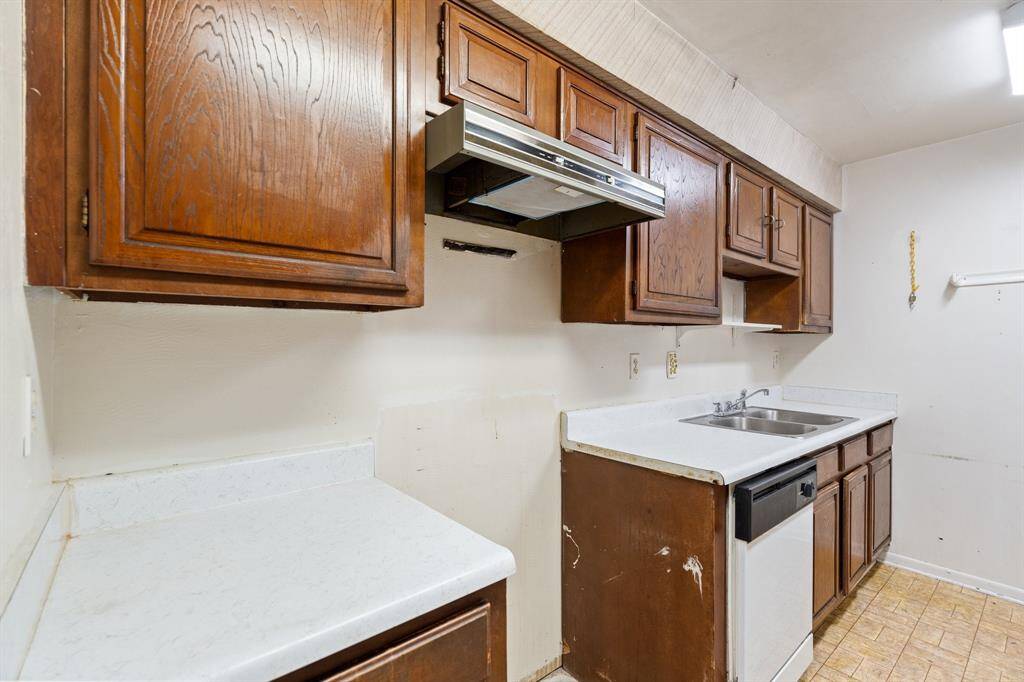 Functional Kitchen Layout! Left-side view showcasing hanging cabinets, your sink, and space for your oven/range.