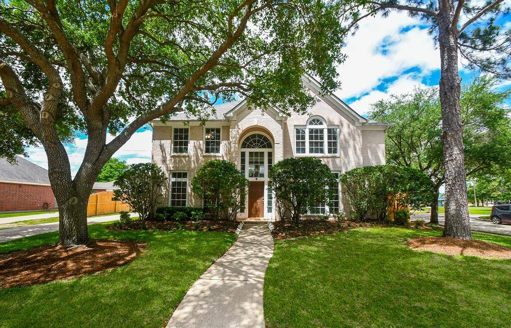 A fabulous front yard with mature frees