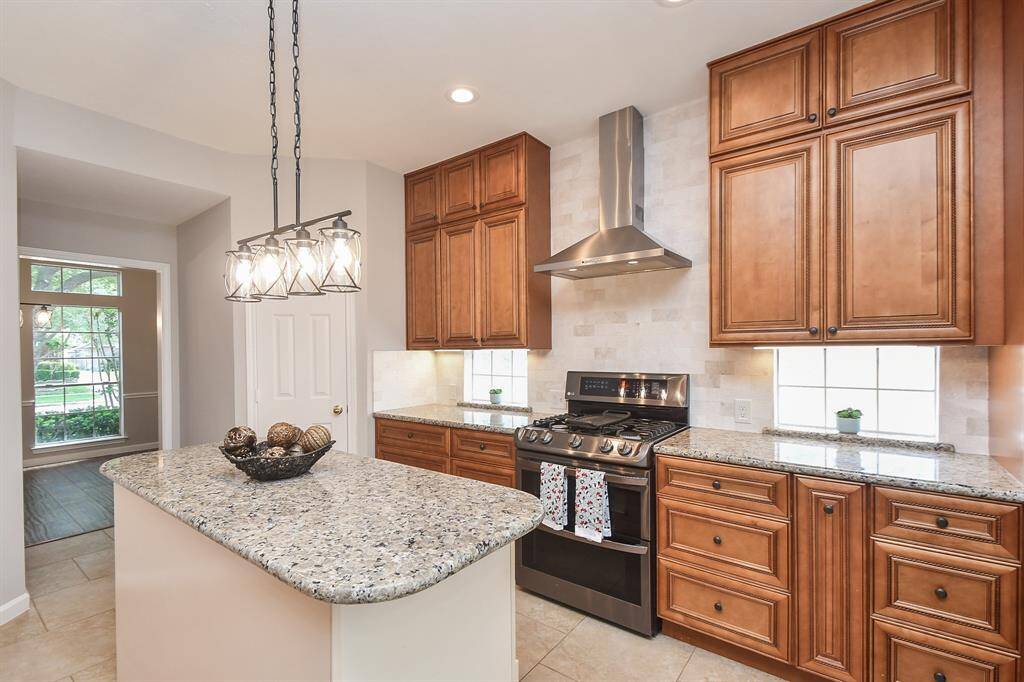 Stainless steel appliances and professional vent hood