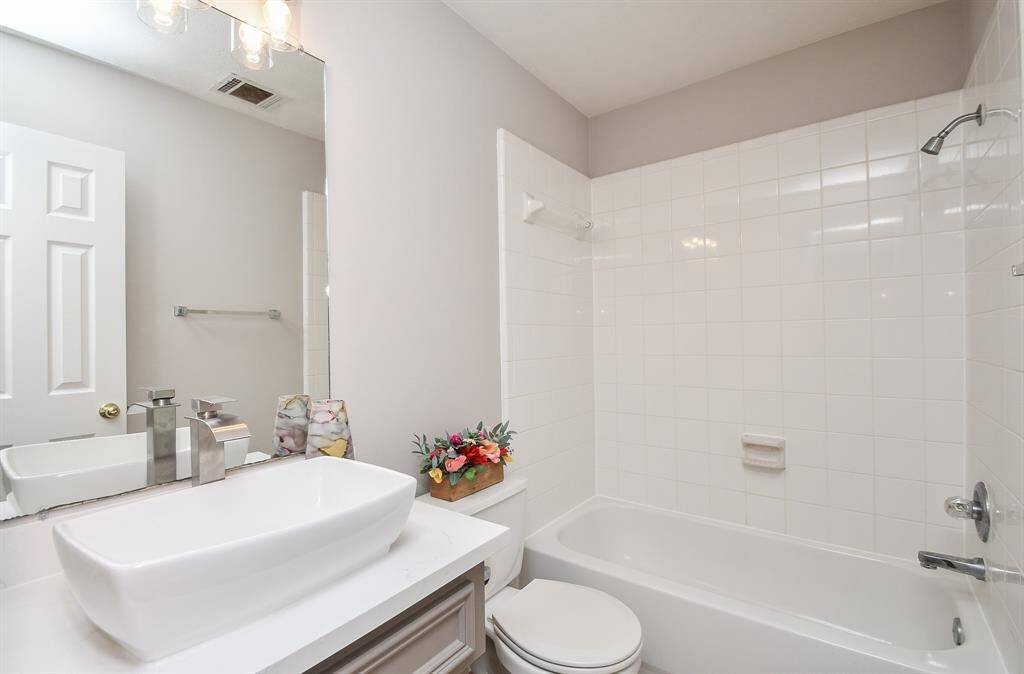 secondary bathrooms with all new sinks, counters and lighting