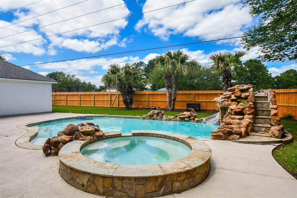 Pool with hot tub and waterfall