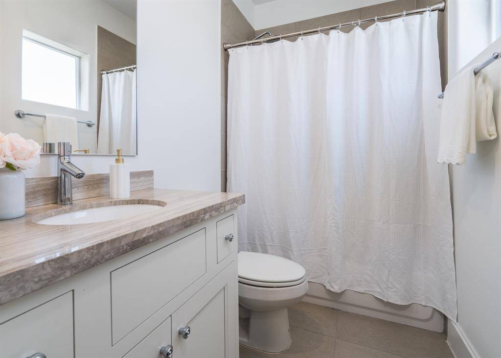 This is the bathroom located in the second bedroom on the third floor.
