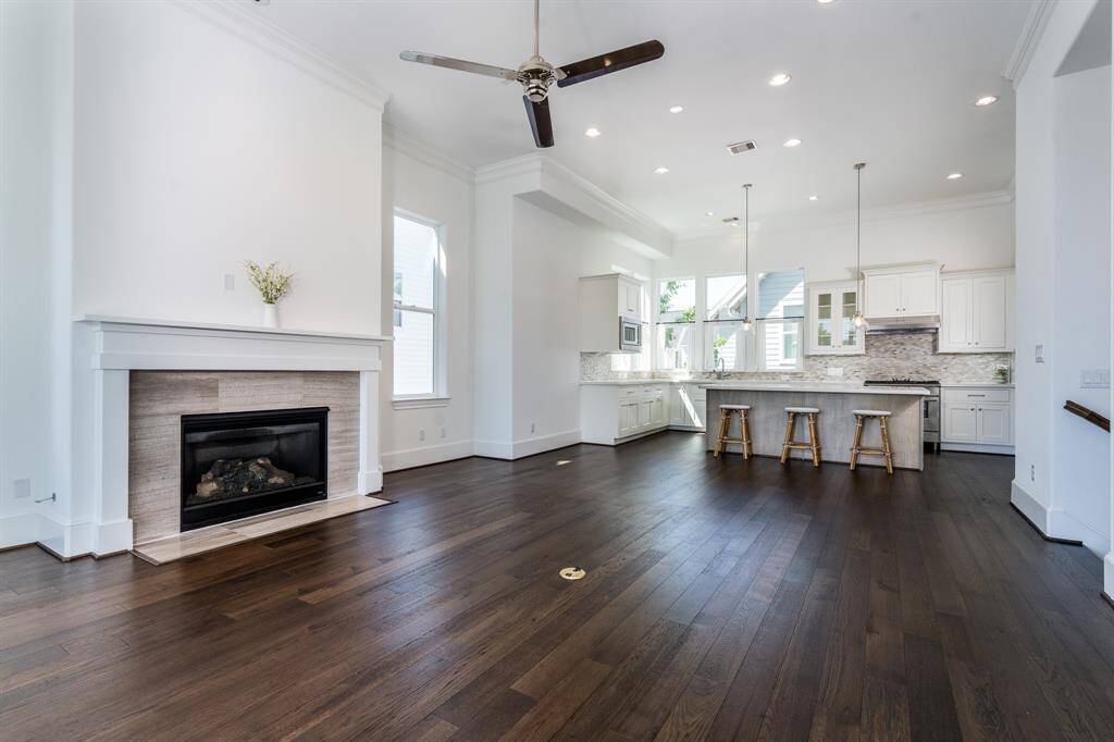The second floor has the main living area and kitchen with a half bathroom. Notice all the lighting, tall ceilings and all the windows!
