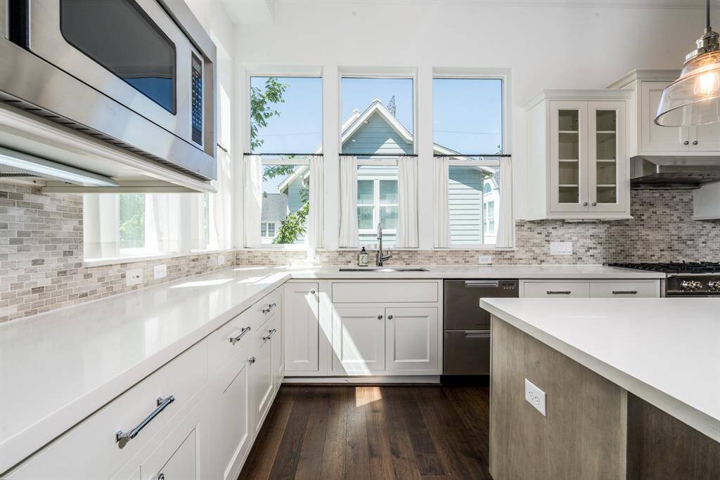 The kitchen has the coolest dishwasher! The two drawer system is a sleek new technology that you will love.