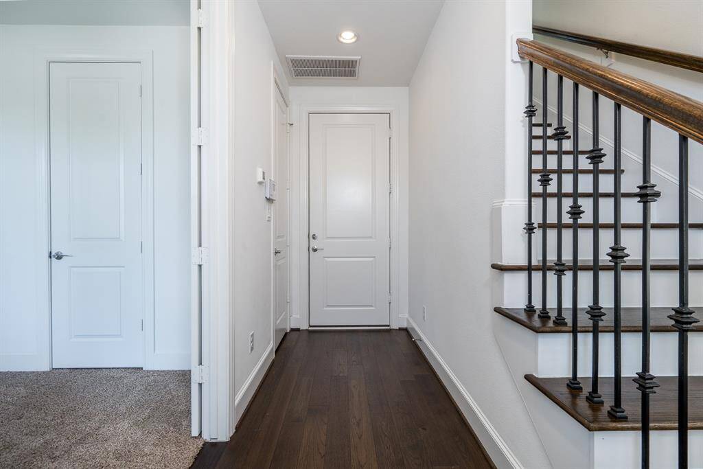 The first floor has both the entrance from the garage and the front door.