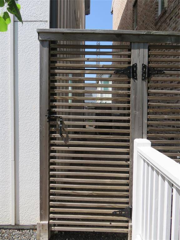 On both sides of the property are locked privacy fences.