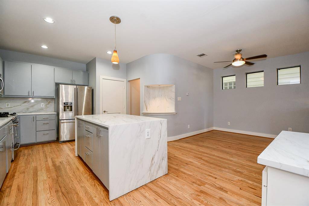 Dining room right off the kitchen and living area with natural window lighting.