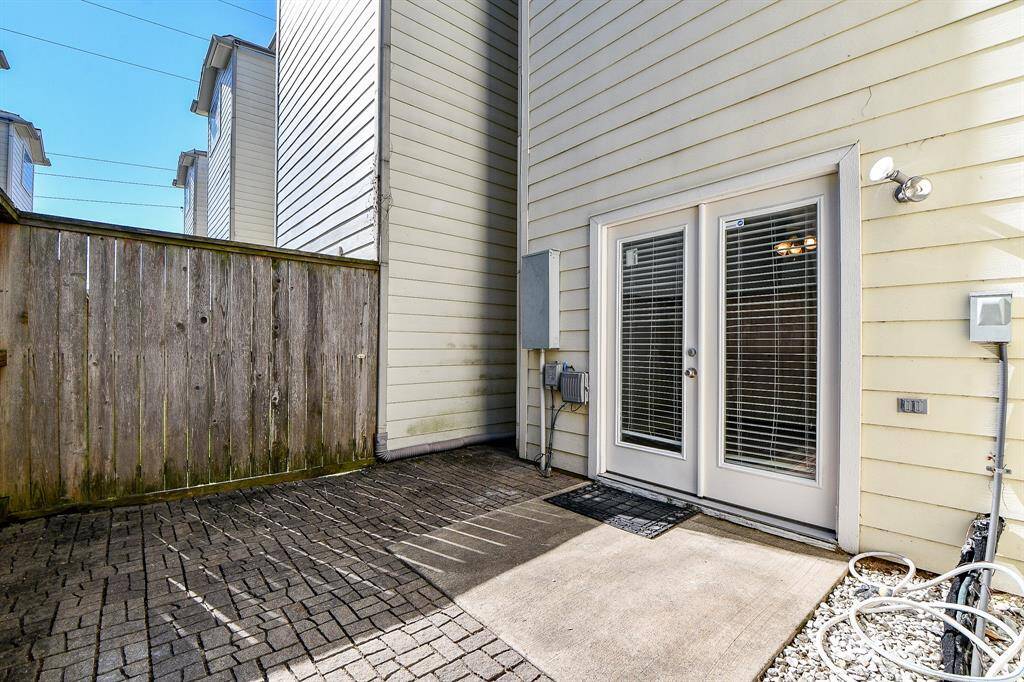 Enjoy some sunshine outside on this private paved patio.
