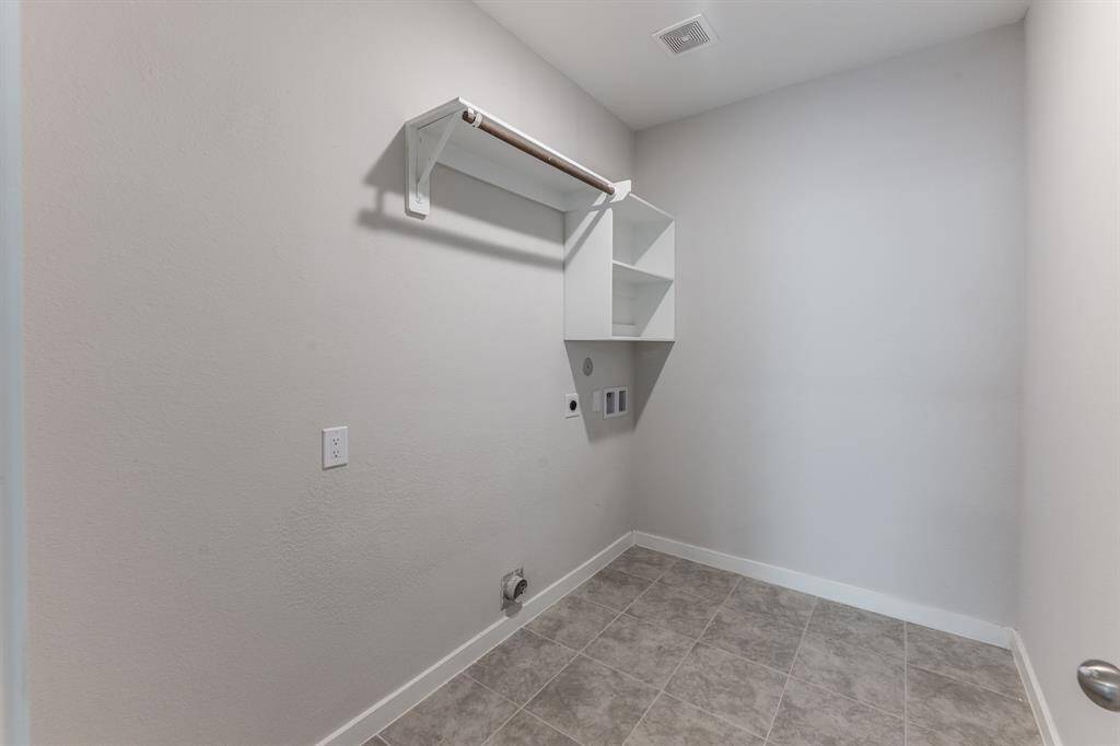 Large utility room by garage on first floor