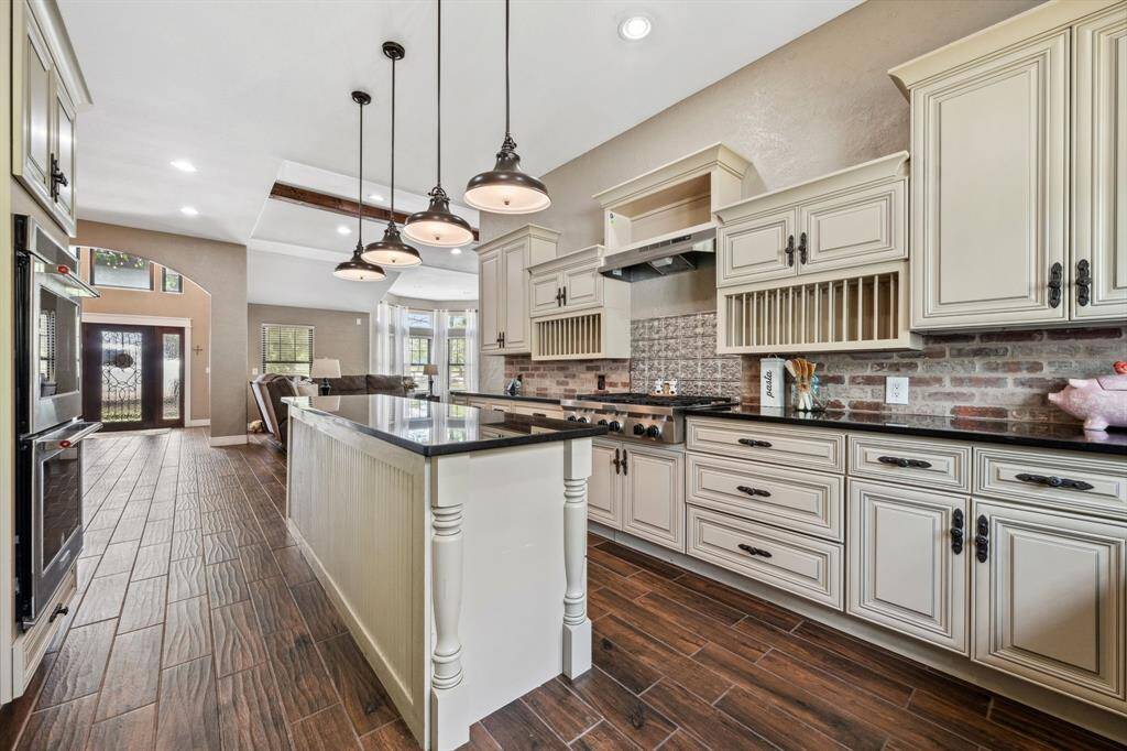 Long, large island with granite countertop