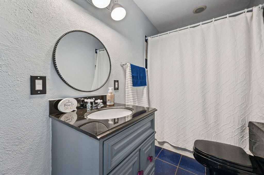 Secondary bathroom has a tub/shower combo and is located right off of the living room.