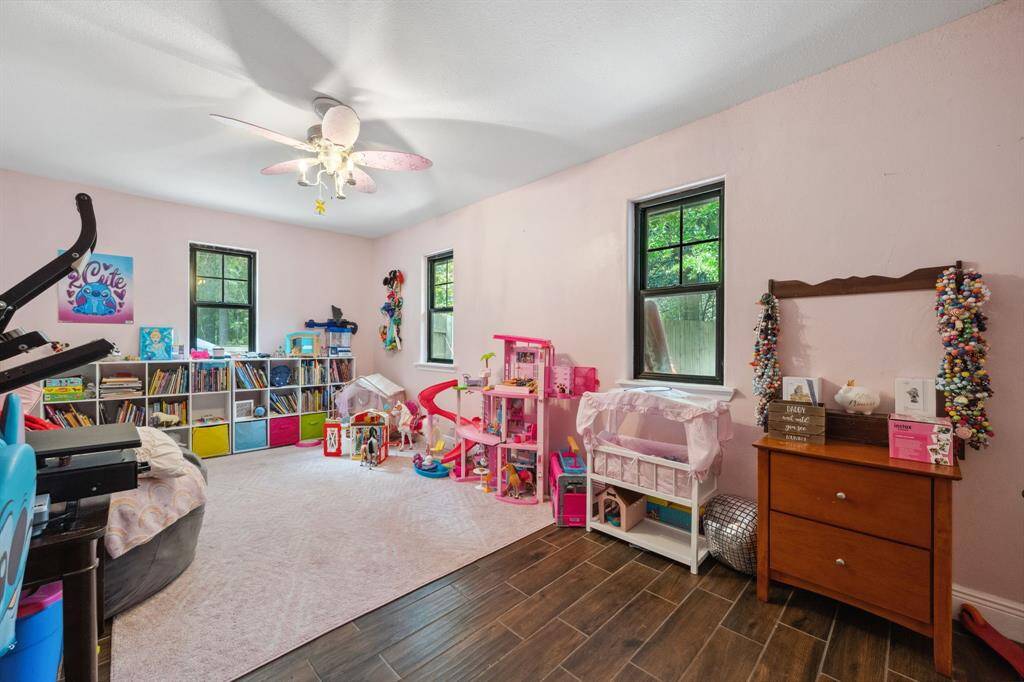 Currently used as a playroom, this is the roomy third bedroom