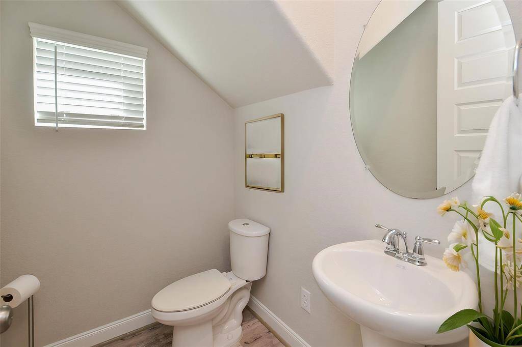 Step into this well-placed half bathroom.