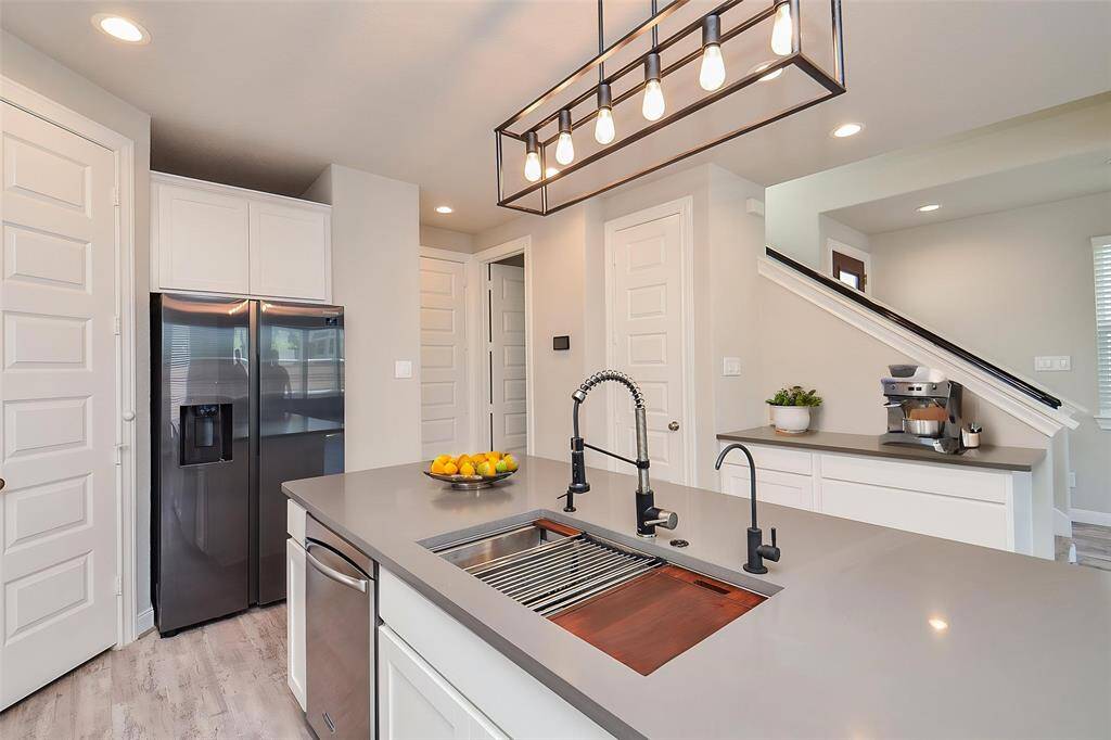 The deep dual sink with its contemporary fixtures makes clean up a breeze.
