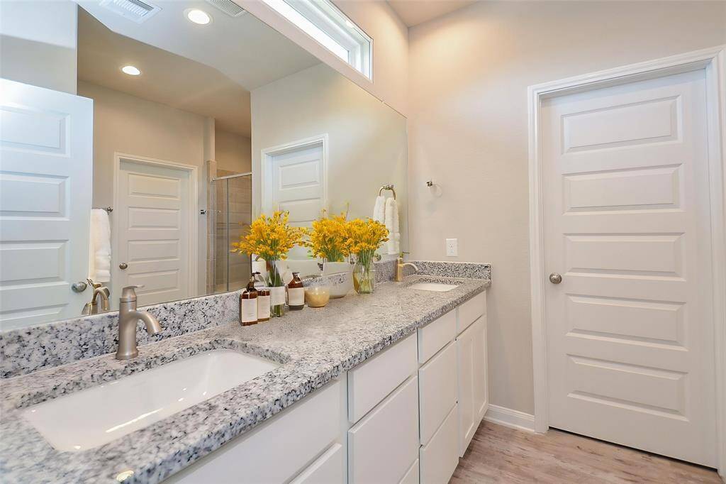 This bathroom provides a clean and sophisticated space ready for personalization.