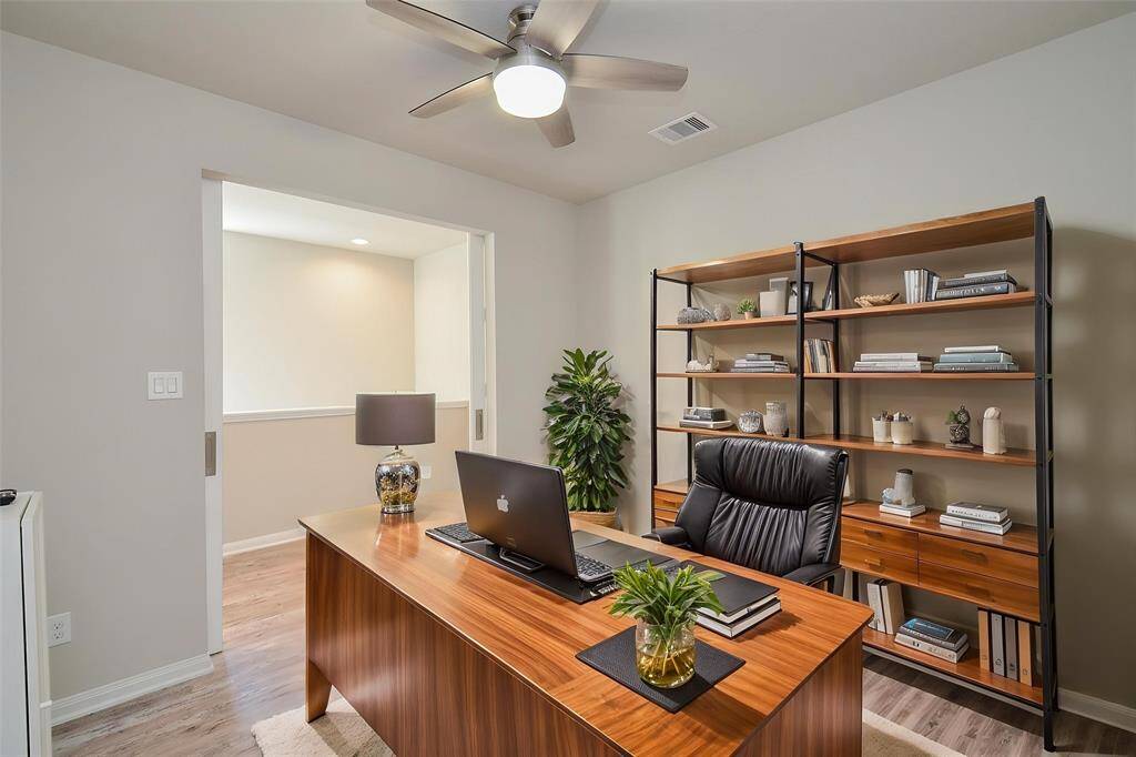 Upon this next room, discover a versatile space perfect not only for a bedroom, but also an in-home office area.