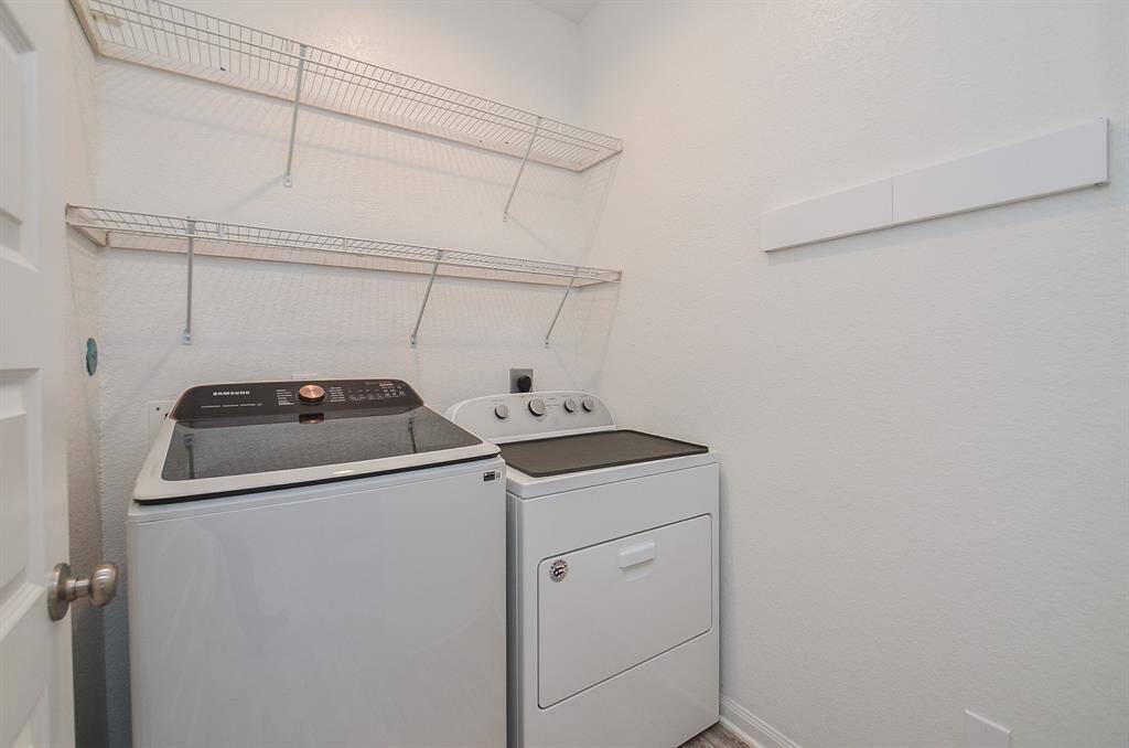 Discover this spacious utility room, perfect for laundry necessities.
