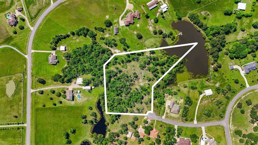 This partially cleared property offers an exceptional opportunity to design a private, upscale residence surrounded by mature trees, serene natural landscapes, and picturesque water features. Boundary lines are approximate and for illustrative purposes only