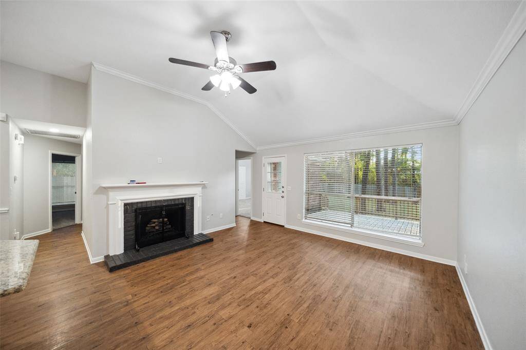 Spacious living area overlooking backyard