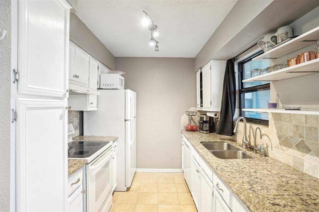 Kitchen with a view of the shared area (With privacy glass windows!)
