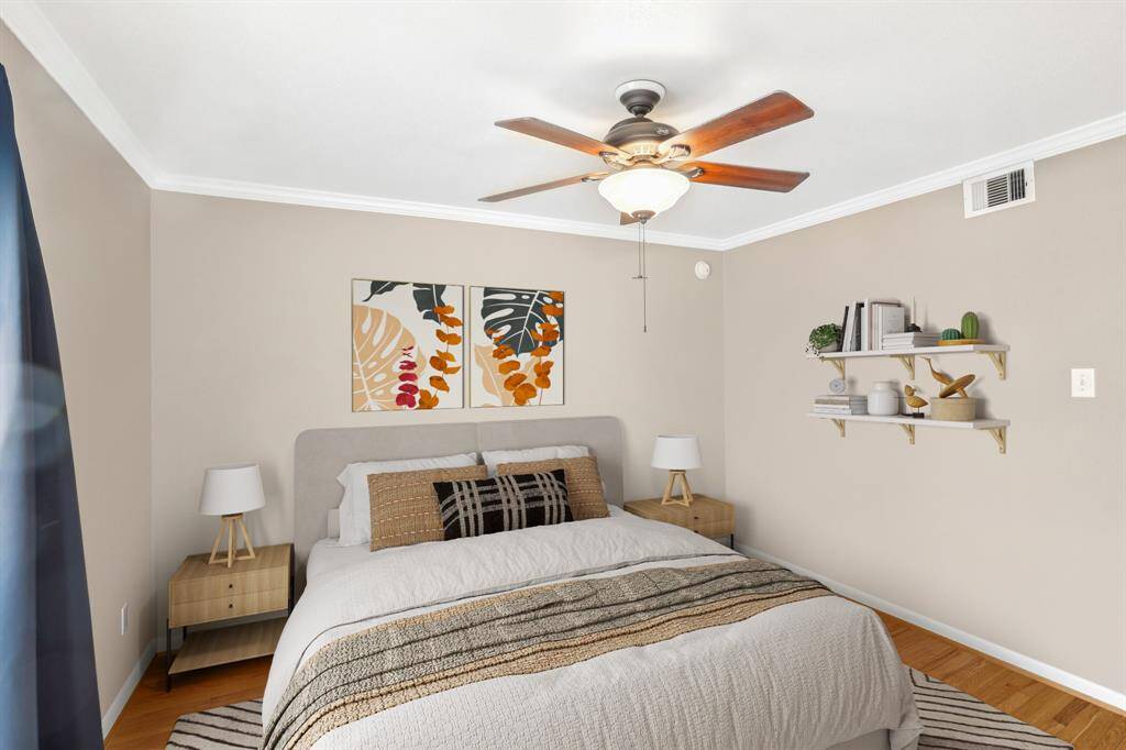 The primary bedroom is beautifully staged to help you envision how you can make the space your own