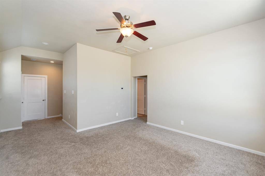 This game room has attic access close by with flooring added for you. Additional closet is also closeby!
