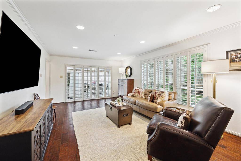 Alternative view of living room with sliding doors leading to the backyard patio