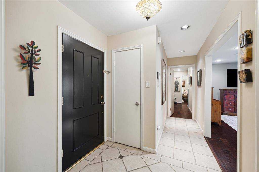 Formal entry is bright and spacious and is adjacent to the living room and dining room, convenient coat closet off of entry
