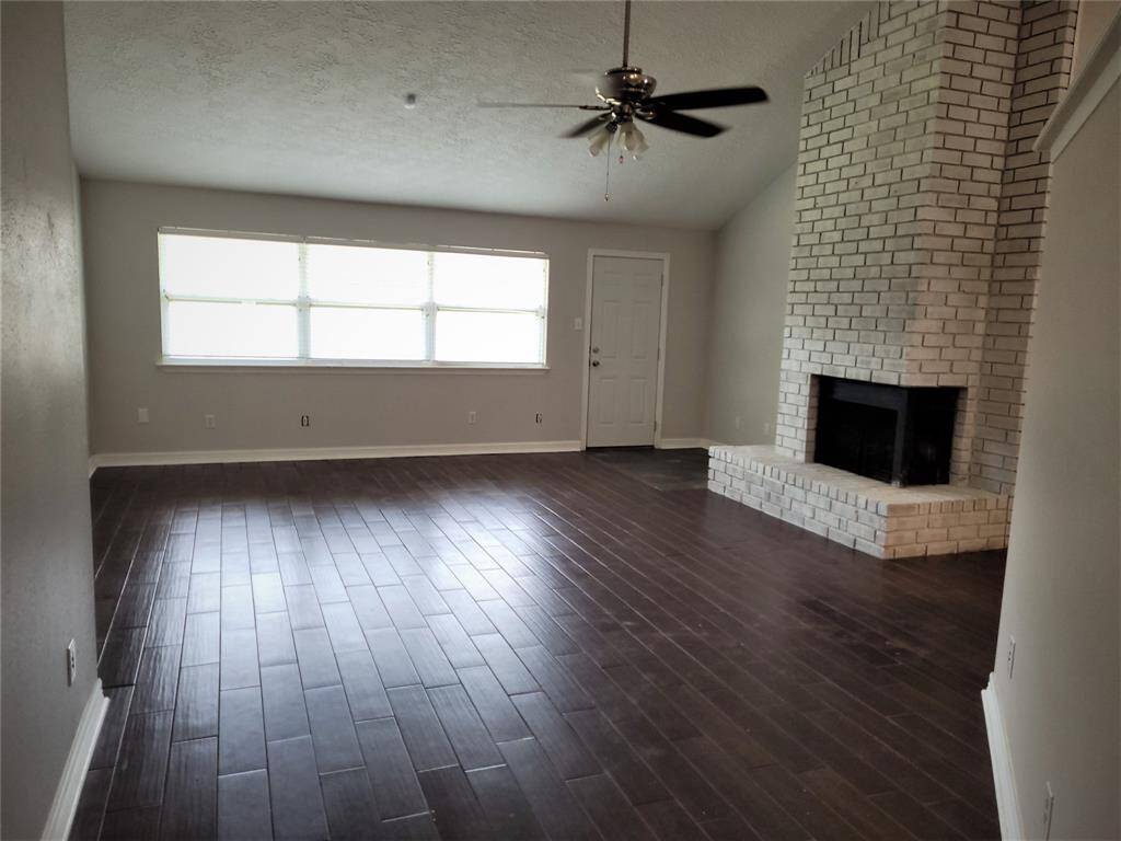 Large family room with fireplace, over looks back yard