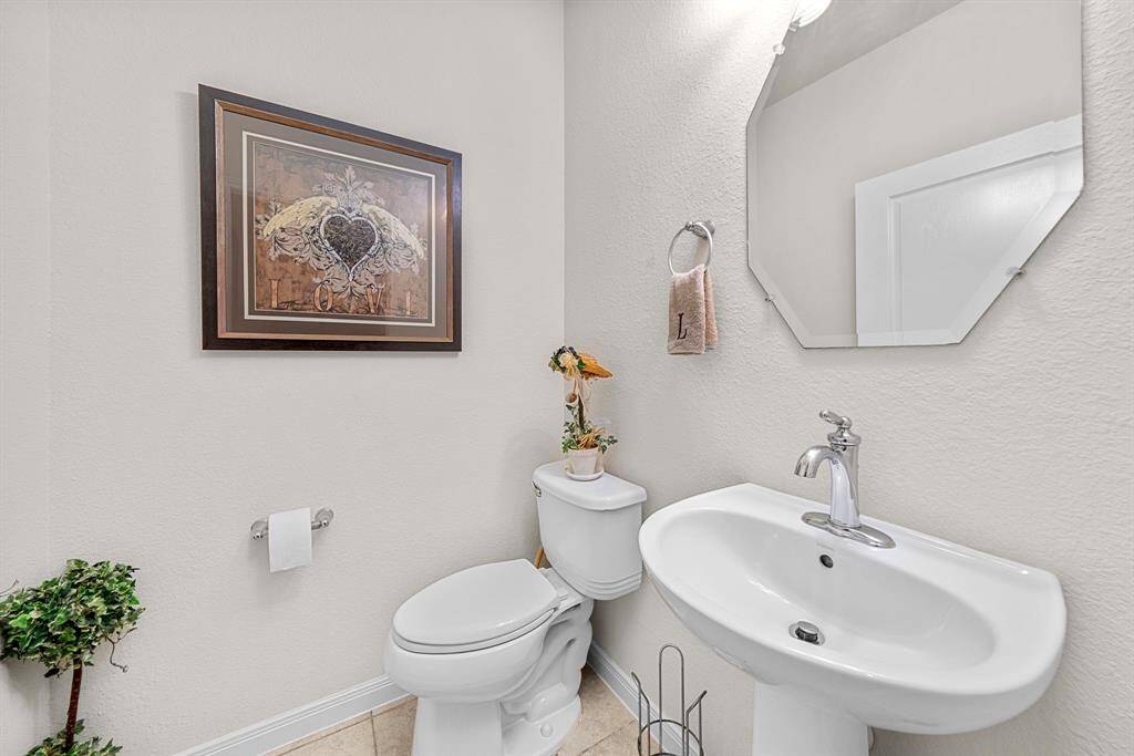 Half bath off the Living Room and Kitchen