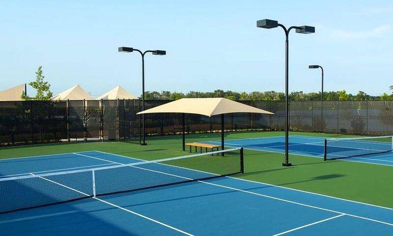 Two lit tennis courts