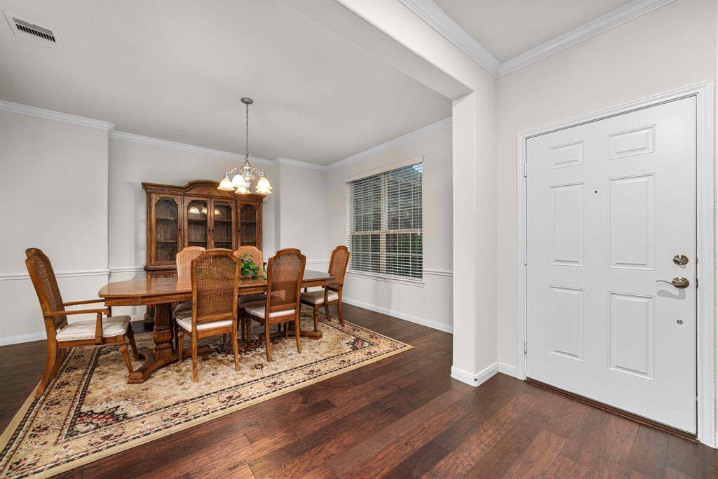 Formal dining room in front right of entrance