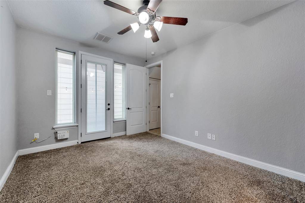 The door on the left from the secondary bedroom on the first floor opens to the lovely yard.