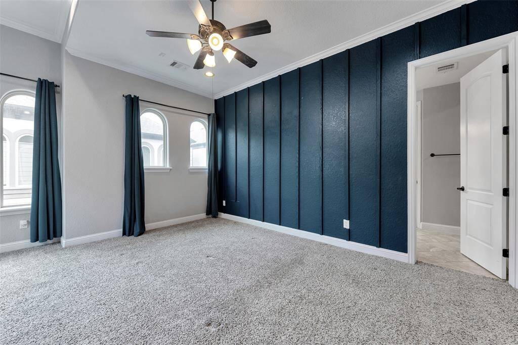 The door to the right leads to the primary bath and a large walk-in closet.