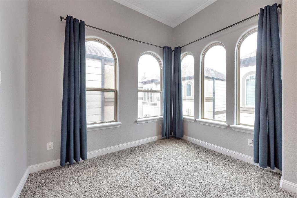 The extra space for a home office or a reading nook make this primary bedroom special.