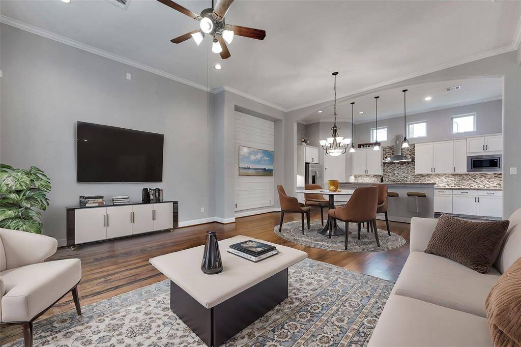 The gorgeous second floor living, dining, and kitchen are open and spacious.
